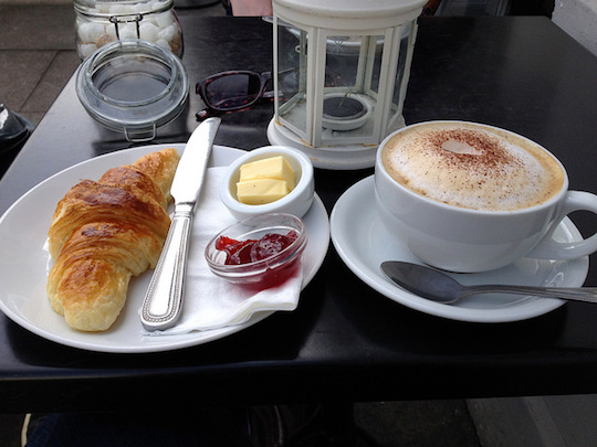Image of coffee and pastry breakfast