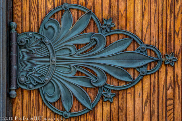 Image of an ornate door hinge