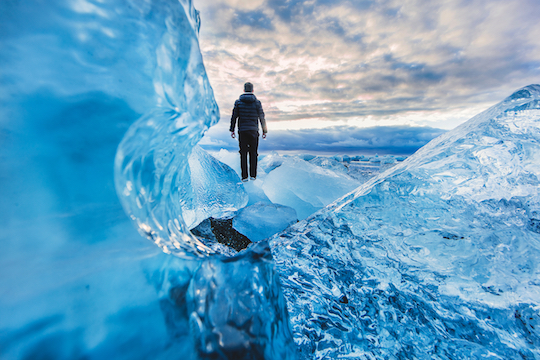 Image of man walking on ice