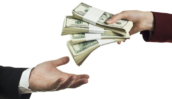 Image of hands trading money