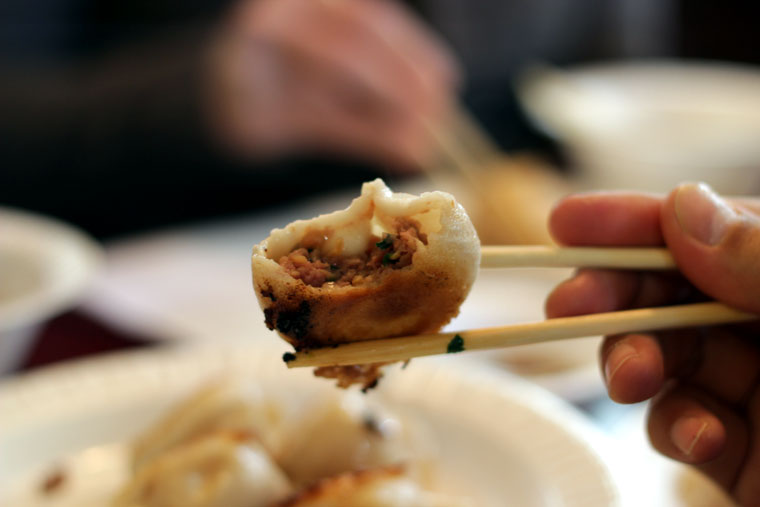 Image of a tasty bite in chopsticks