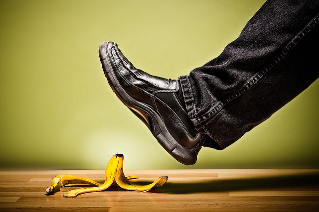 Image of a man's foot about to step on a banana peel