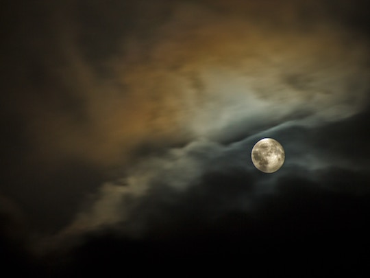Image of a full moon in a volatile sky