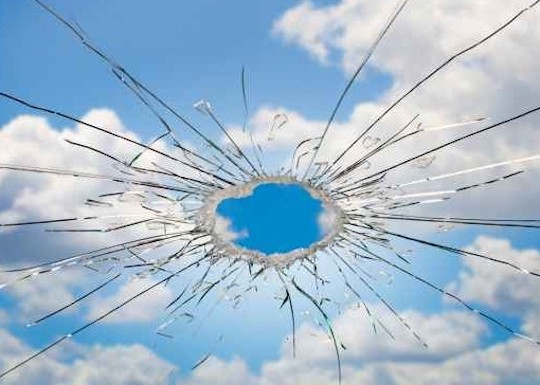 Image of the sky through shattered glass