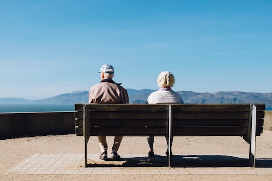 Image of an elderly couple sitting on a bench