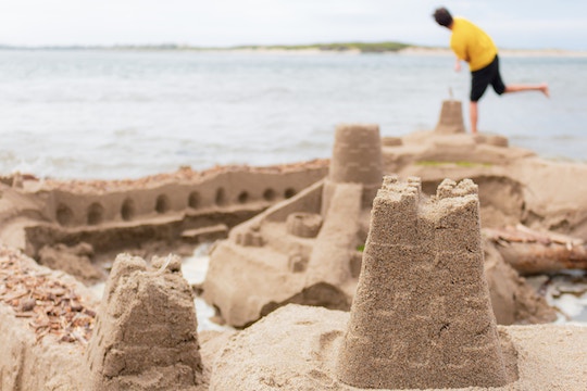 Image of a sand castly by the ocean