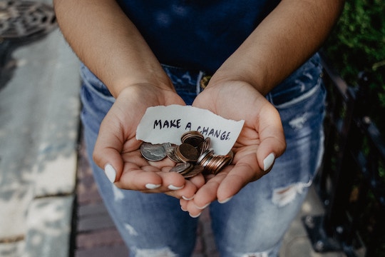 Image of a woman holding coins and a note stating "make a change"