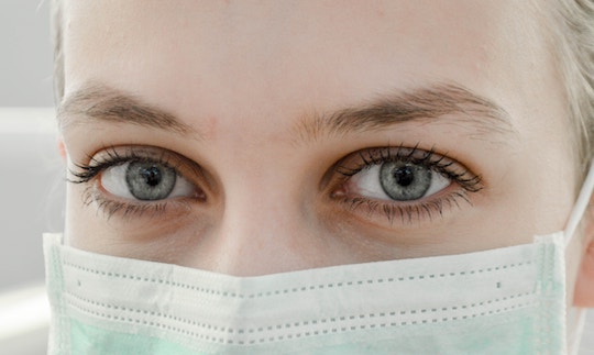 Image of a woman wearing a surgical mask