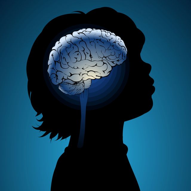 Sillhouette of a child with drawing of a brain 