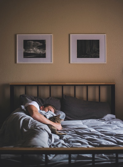 Image of a guy in bed early morning