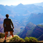 Guy standing on a mountain