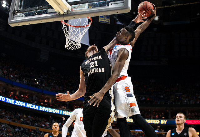 Image of basketball players at the net