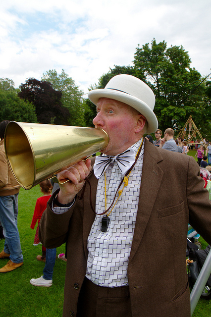 Image of an announcer with a bullhorn