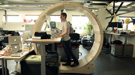 Image of a man at a wlaking desk