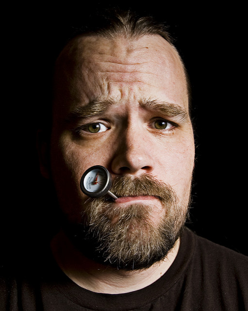 Image of man with thermometer in his mouth