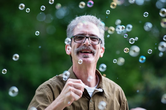 Image of a man surrounded by bubbles