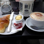 Image of a coffee cup and croissant