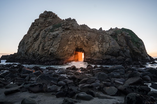 Image of a door through a huge rock