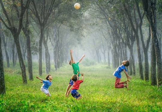 Boys jumping in a field