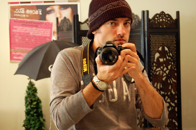 Image of a man photographing himself in a mirror