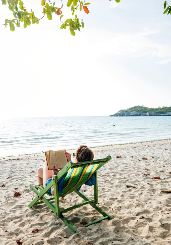 Image of woman lounging on a beach chair 