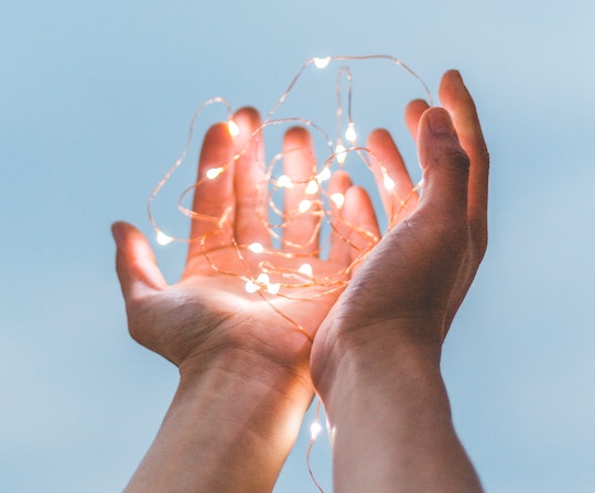 Image of hands holding light