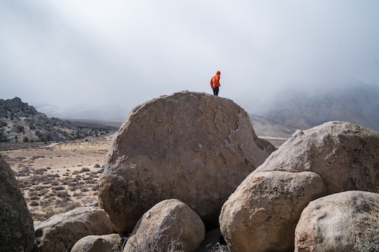 Image of a man on a boulder