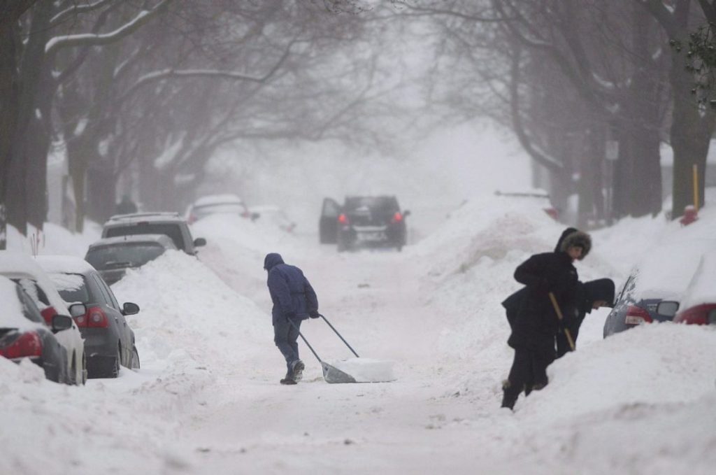 Image of cars buried in snow