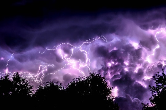 Image of a dark purple sky with lots of lightning