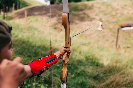 Image of a boy shooting an arrow